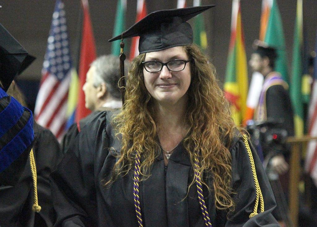 Glory Hartsfield, fine arts, is teary eyed after hugging her professors after walking the stage at Commencement in the Kay Yeager Coliseum, May 14. Photo by Rachel Johnson