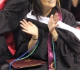 Andrea Moreno, clinical psychology, claps for her familyat the end of Commencement, held ing Kay Yeager Coliseum, May 14. Photo by Rachel Johnson