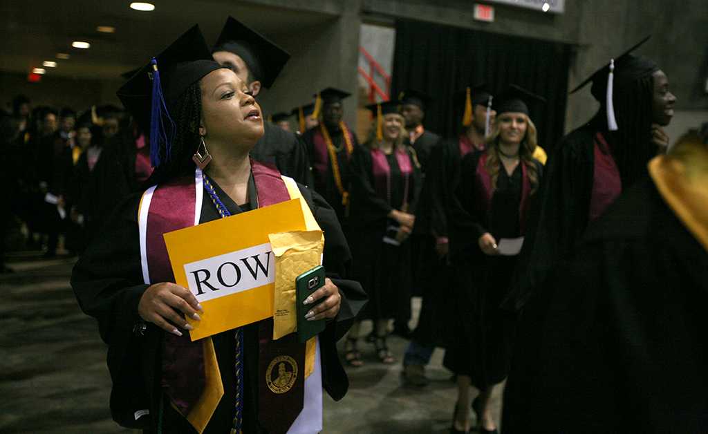 Tracey Tyson enters the coliseum at Midwestern State University graduation, May 13, 2017. Photo by Bradley Wilson