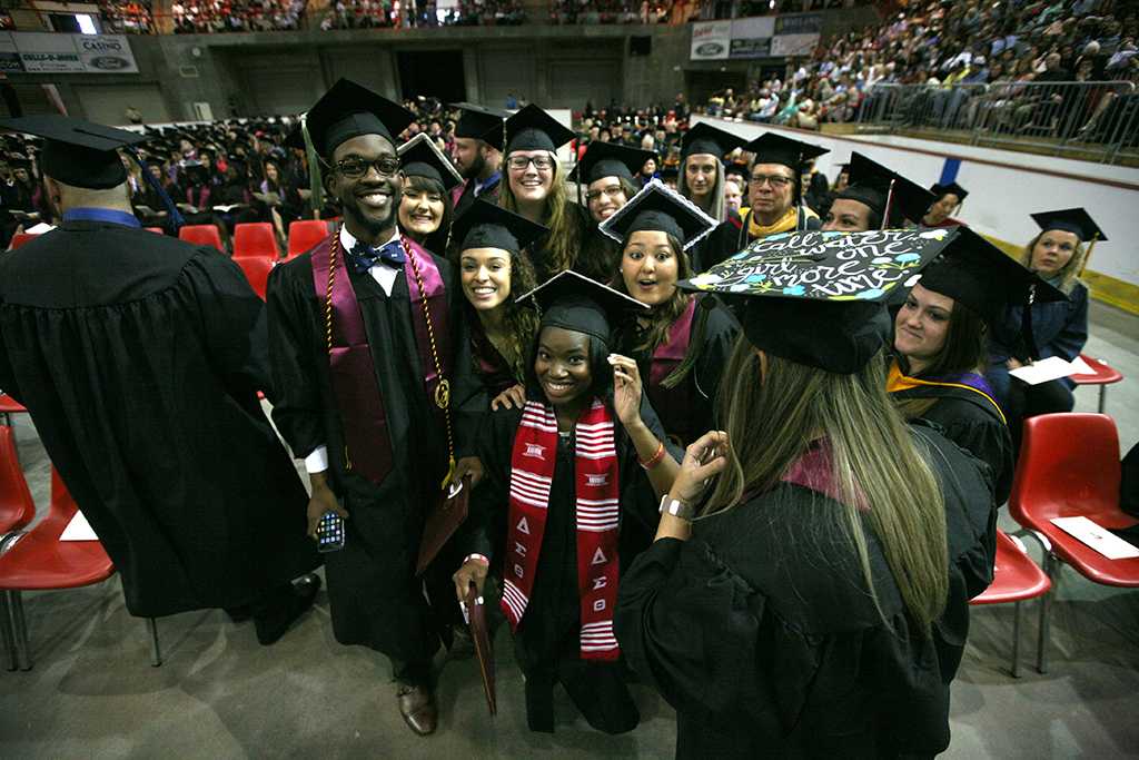 Graduates pose for a picture at Midwestern State University graduation, May 13, 2017. Photo by Bradley Wilson