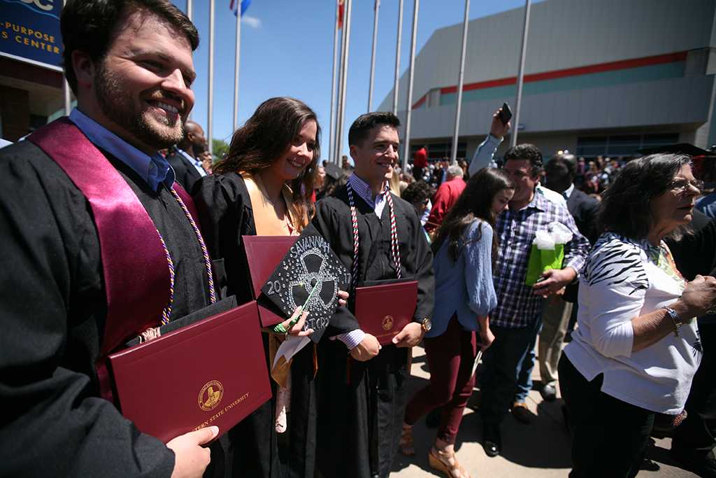 Preston Jones, business administration, Savannah Terry, radiology, and Hunter Jones, business administration, at Midwestern State University graduation, May 13, 2017. Photo by Bradley Wilson