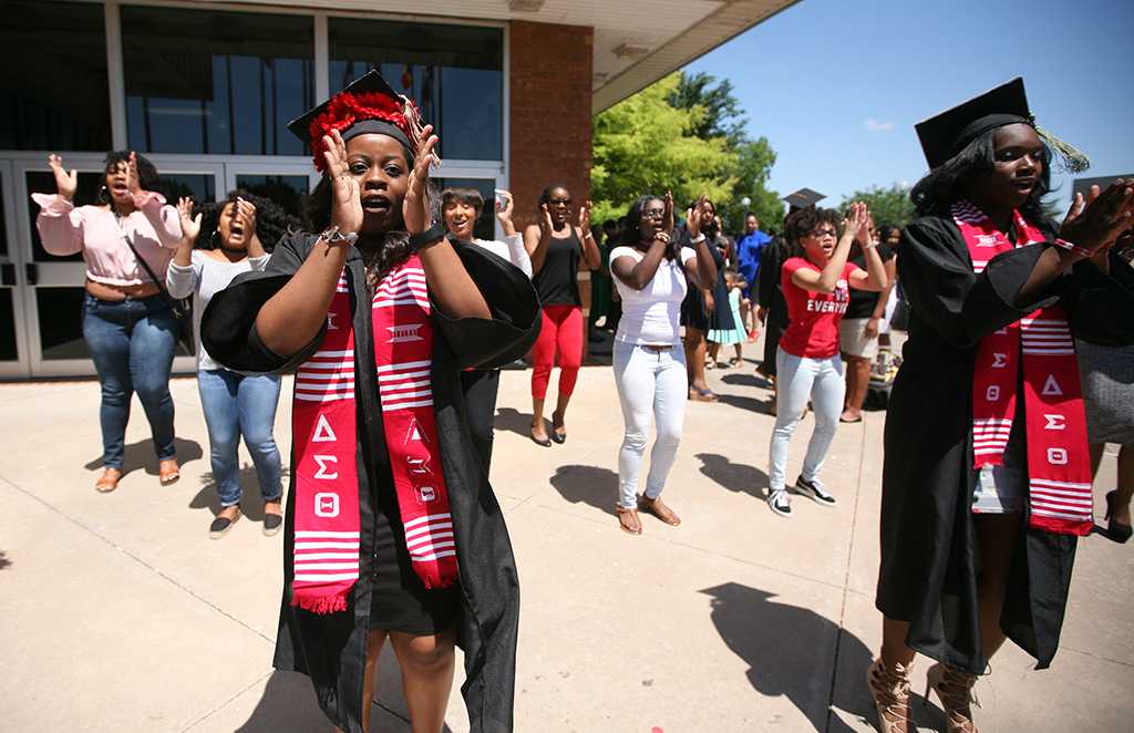 Briana Frazier does a step with her Delta Sigma Theta sisters after Midwestern State University graduation, May 13, 2017. Photo by Bradley Wilson