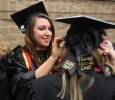 Emma Davenport Respiratory Care graduate helps fellow Respiratory Care graduate put on graduation cap.Midwestern State University Commencement Cermemony, Kay Yeager Coliseum.May 14th.by Timothy Jones