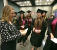 Ann Arnold-Ogden, announcer, goes over names with students at Midwestern State University graduation, May 13, 2017. Photo by Bradley Wilson
