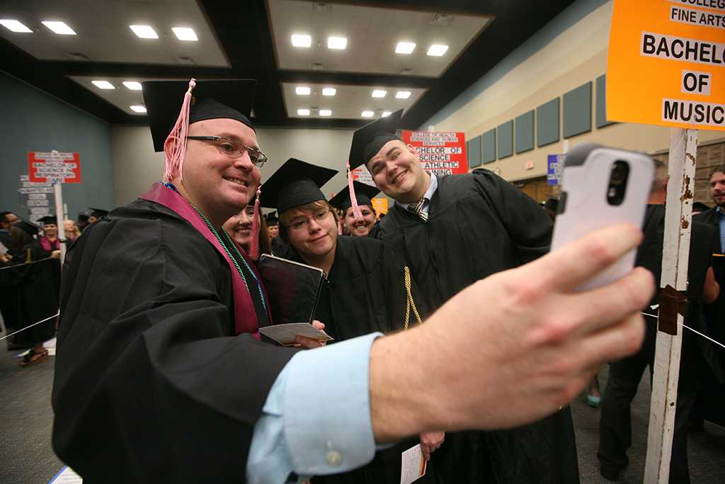 Music students pose for a selfie at Midwestern State University graduation, May 10, 2014. Photo by Ethan Metcalf