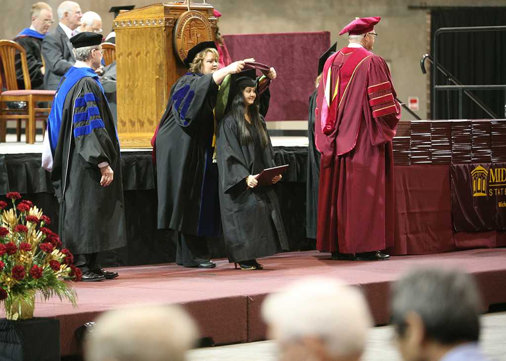 Dipika Nayak graduating with a master in exercise physiology at Midwestern State University graduation, May 10, 2014. Photo by Ethan Metcalf
