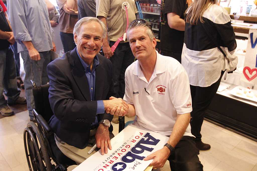 Gubernatorial hopeful Greg Abbott spoke at 8th Street Coffee House in Wichita Falls, Feb. 18. After the political rally, Abbott spoke one-on-one with Wichita Falls Locals. Robert Drover, MSU graduate, has lived in Wichita Falls his whole life and was lucky enough to talk to Abbott in person. Photo by Sam Croft.