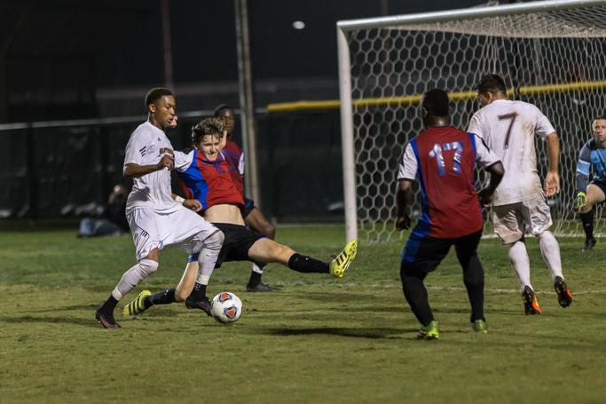 Taylor Leon, finance senior, fights for the ball during the heartland conference semi-final game on Nov 4. Photo by Izziel Latour