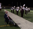 Retiring university President Jesse Rogers listens as the band plays a series of songs in recongition of his retirement at the homecoming game, Oct. 25, 2015. Photo by Bradley Wilson