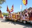The cheerleaders yell cheers and chants to the crowd as they parade around in their float at the annual Midwestern State Homecoming Parade which went around the whole campus, starting from the parking lot by the football practice field and ending by the quad, on Saturday morning. They announce the winners for best float at the Homecoming football game Saturday night. Photo by Rachel Johnson