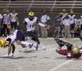 Ricardo Riascos, criminal justice senior, hits Commerce's freshman wide-reciever Shawn Hooks as he tries to catch a punt in the game between Midwestern State University and Texas A&M-Commerce, Saturday, Oct. 25, 2014 at Memorial Stadium. Photo by Lauren Roberts