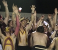 Members of the stanggang raise their hands and cheer at the game between Midwestern State University and Texas A&M-Commerce, Saturday, Oct. 25, 2014 at Memorial Stadium. Photo by Lauren Roberts