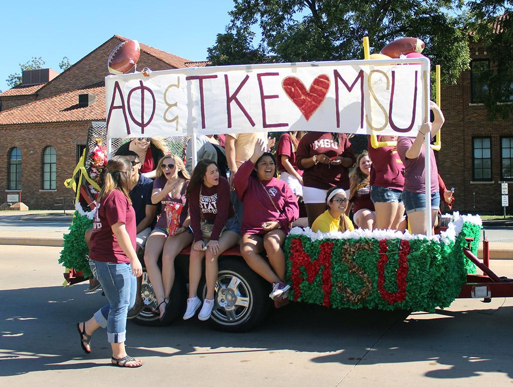 Alpha Phi and Tau Kappa Epsilon joined together to make their Homecoming float for the annual Midwestern State Homecoming Parade which went around the whole campus, starting from the parking lot by the football practice field and ending by the quad, on Saturday morning. They announce the winners for best float at the Homecoming football game Saturday night. Photo by Rachel Johnson