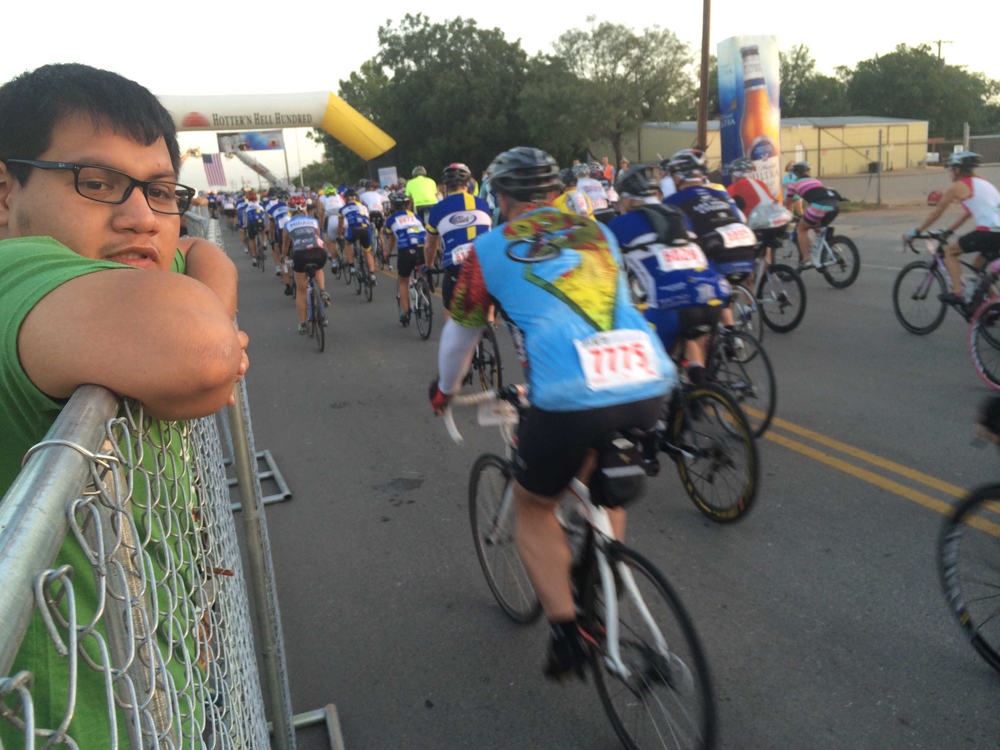 Marco Torres, psychology senior, watches the endless stream of racers leave the starting gates as he waits to deflate and transfer "Pyro Pete" to the Hell's Gate rest stop in Burkburnett. Photo by Ethan Metcalf