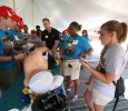 In the medical tent, Moriah Mann (with clipboard), a sophomore in athletic training, works with patient Robert Founds after he fell in the HotterâN Hell in Wichita Falls, Texas. Photo by Bradley Wilson
