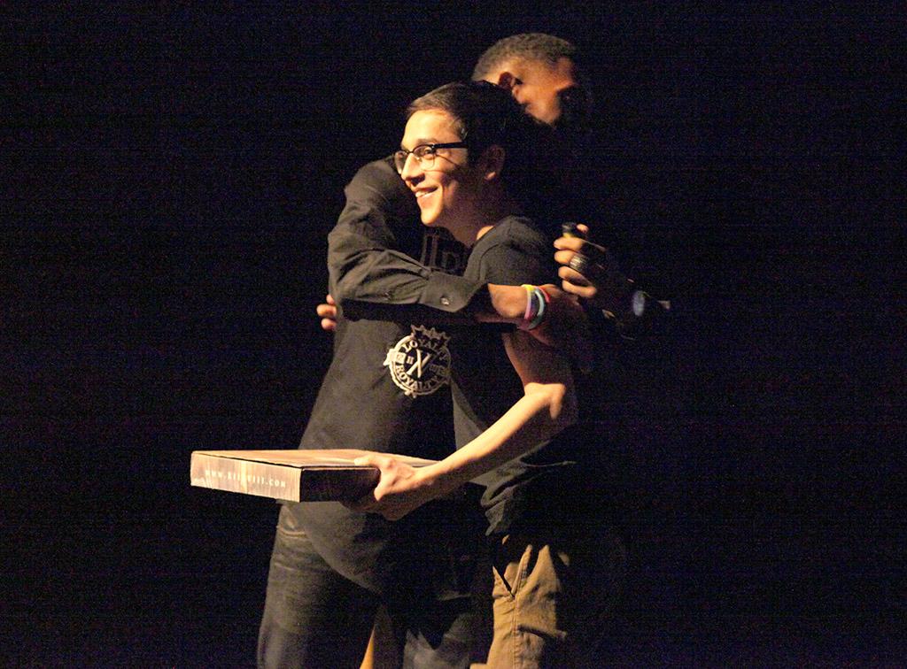 Christopher Cruz, theater freshman and P.R.I.D.E. president, is given a few gift from Terrence Clemens, LGBTQ+ issues speaker, who thanked Cruz for communicating with him and bringing him to MSU for the first social justice movement week, this event was held in Fain FIne Arts Auditorium, March 31. Photo by Rachel Johnson
