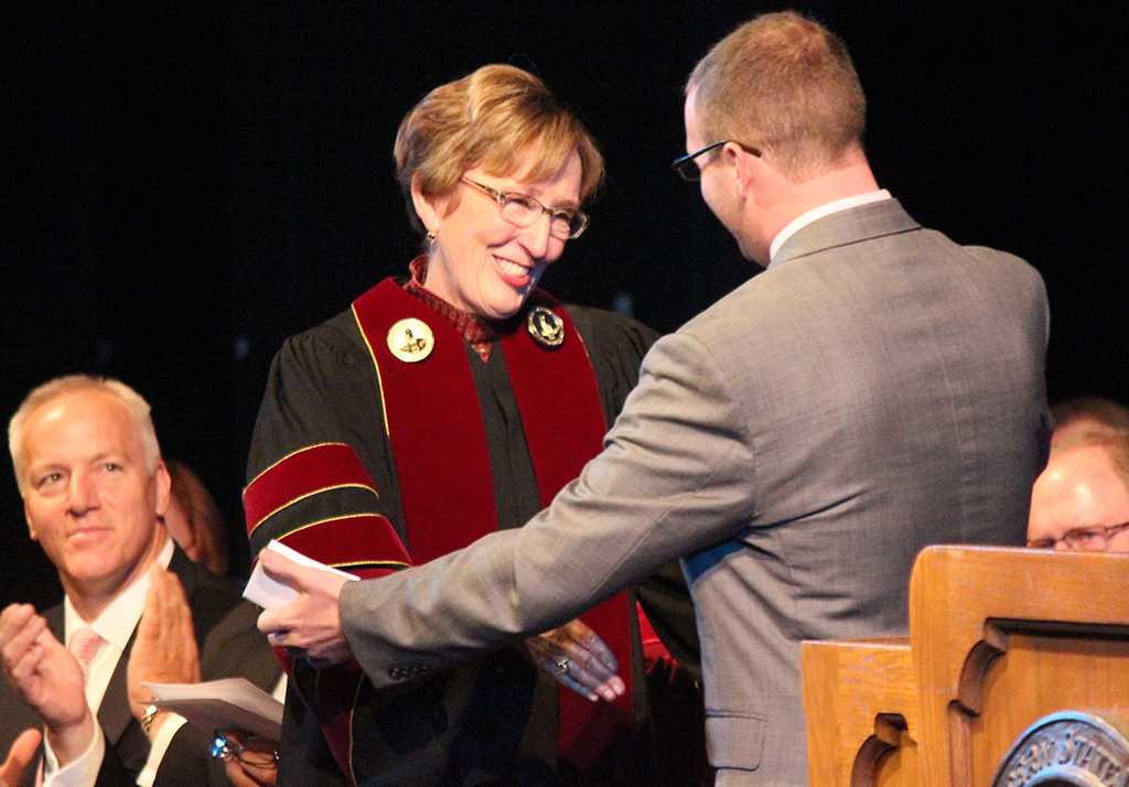 Jesse Brown, criminal justice senior, hugs Suzanne Shipley after his "Greetings from the students" speech about President Suzanne Shipley at the inauguration of Shipley, the eleventh president, held in Fain Fine Arts Auditorium, Dec. 11, 2015. Photo by Rachel Johnson