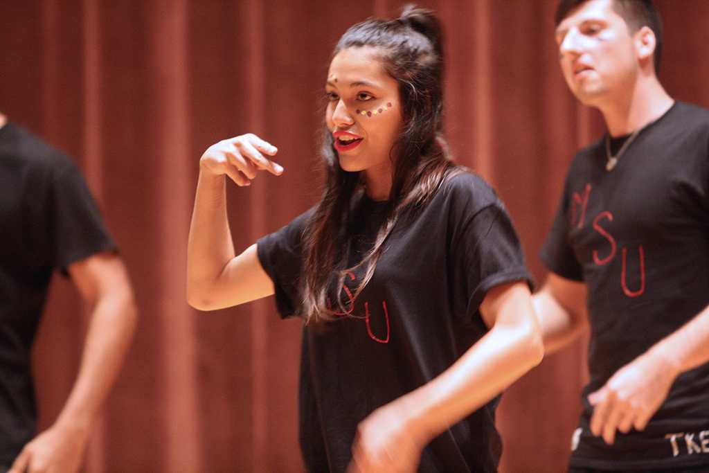 Ashly Acevedo, respiratory care sophomore on stage at Lip Sync in the Akin Auditorium 24 Oct. Photo by Bridget Reilly