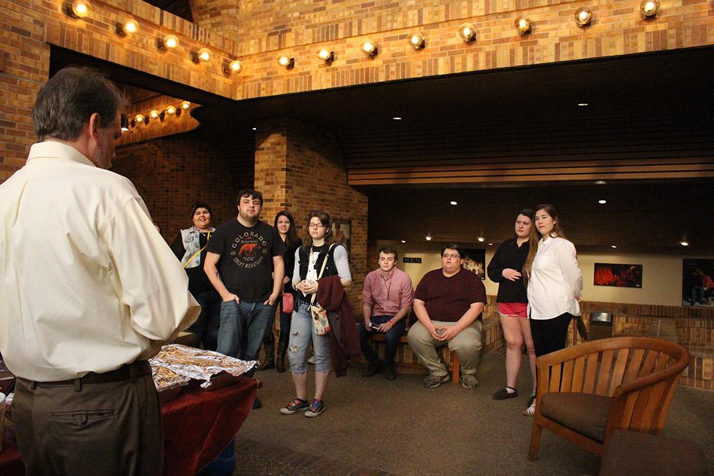 Actors and Student listen to Dr. Todd Giles, head of the Arts and Literature Society, at the beginning of the Lysistrata play meet-and-greet on March 5th in the Fain lobby. Photo by Kayla White.