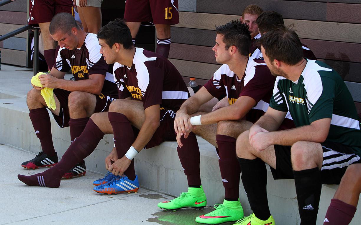 Members of the men's soccer team sit in the shade during halftime against FC Dallas at Moneygram Soccer Park in Dallas Saturday afternoon. The tempature was 99 degrees with 45% humidity. The match ended 2-0. Photo by Lauren Roberts