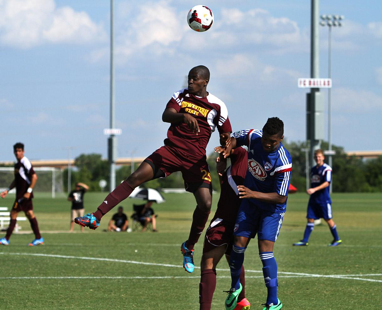 Hindowa Momoh, psychology freshman, heads the ball at Moneygram Soccer Park in Dallas Saturday afternoon. The game ended 2-0 against FC Dallas. Photo by Lauren Roberts