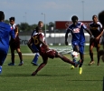 Hindowa Momoh, psychology freshman, tries to get the ball past FC Dallas defenders at Moneygram Soccer Park in Dallas Saturday afternoon. The match ended 2-0. Photo by Lauren Roberts