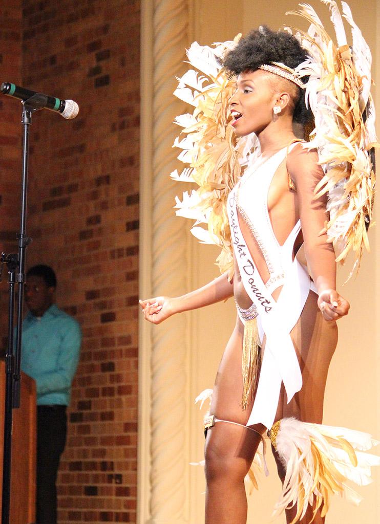 Larissia Gumbs, psychology sophomore, introduces herself in the first round of the 2015 CaribFest Pageant, the ice breaker portion, which was the only part of the competition that was not judged, Sept. 23. Photo by Rachel Johnson
