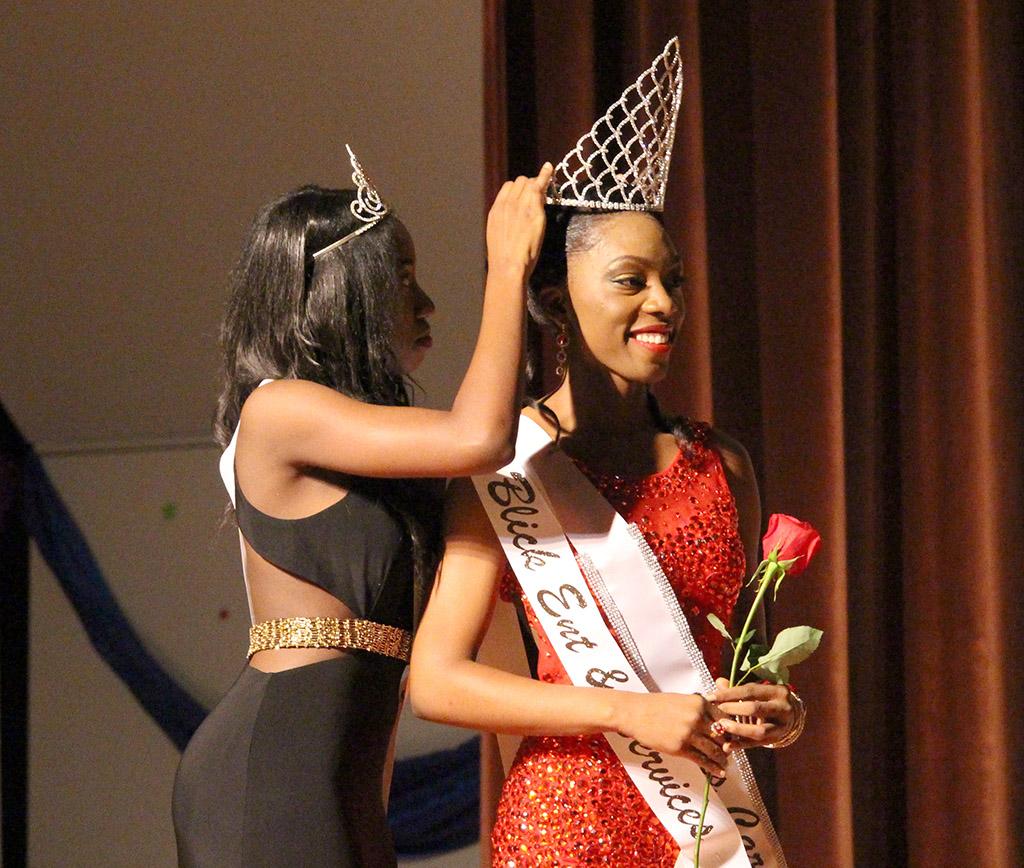 Jorrey Martin, speical education sophomore, is crowned Miss CaribFest 2015 by Miss CaribFest 2014, Indira Placide, biology senior, at the end of the 2015 Carib