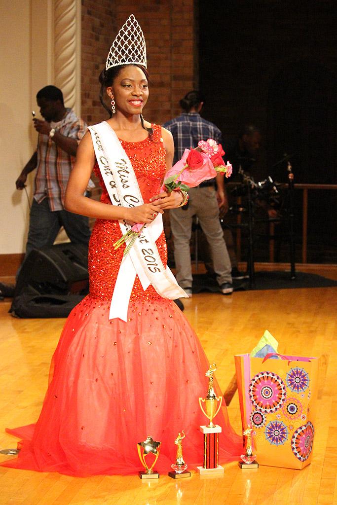 Jorrey Martin, special education sophmore and Miss CaribFest 2015, poses with her awards and crown in her evening gown for photos at the end of the CaribFest Pageant in the Akin Auditorium, Sept. 23. Photo by Kayla White