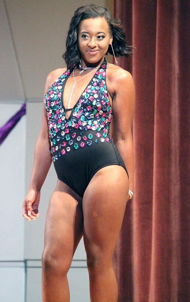 Bobbi Rivers, nursing sophomore, models her swimsuit wear in the swimsuit portion of the 2015 CaribFest Pageant held in the Akin Auditorium, Sept. 23. Photo by Rachel Johnson