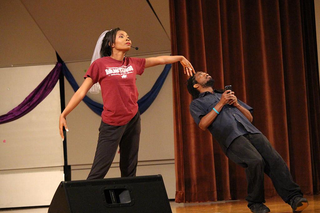 Kornika Degannes, finance junior, preforms in personality portion with Ciint George, MSU alumni, interprets her version of the word commitment at the CaribFest Pageant 2015 in the Akin Auditorium, Sept. 23. Photo By Kayla White