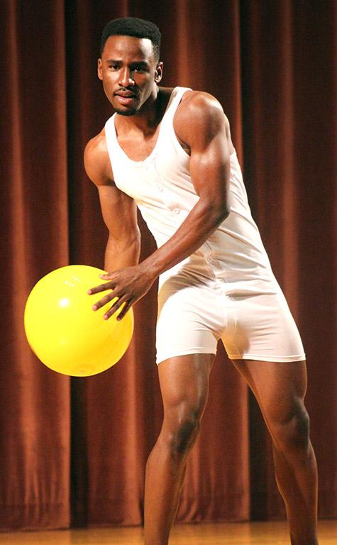 Rocksen Jean-Louis, music sophomore, throws a beach ball into the audience  during the swim wear portion of the 2017 Mr. and Miss Caribfest Pagaent held in Akin Auditorium Sept. 28. Photo by Marissa Daley