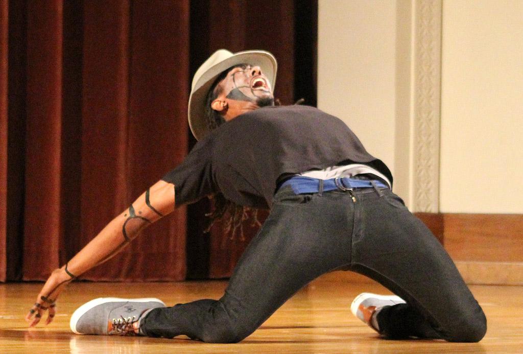 Edward Collins, psychology freshman, bends over backwards in the talent portion of the the 2017 Mr. and Mrs. Caribfest in Akin Auditorium on Sept 28. Photo by Marissa Daley