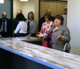 Kristi Schulte, housing director, gives details about the Faculty-in-Residence apartment in Legacy Hall to the Board of Regents during a walk-through on Aug. 4.