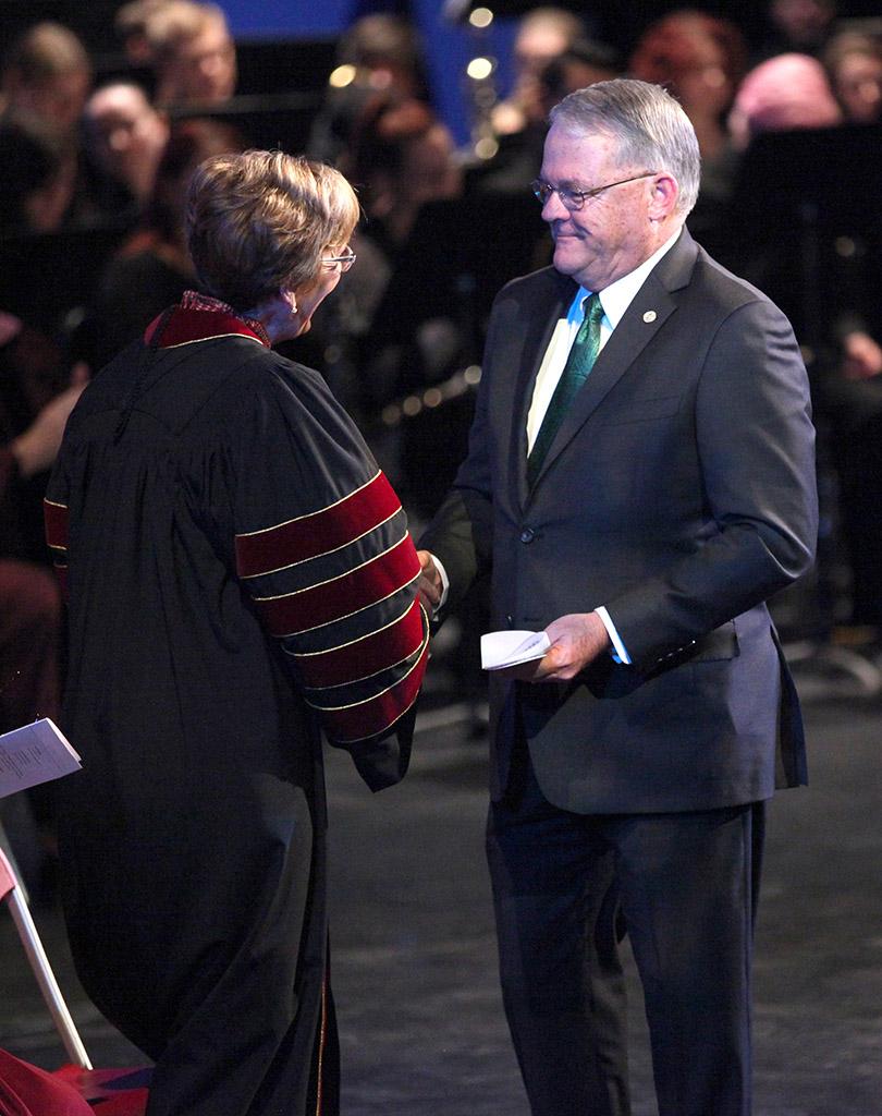 Glen Barham, Mayor of Wichita Falls, shakes  Suzanne Shipley, university president, hand after speaking at the Presidential Inauguration in Fain Fine Arts Center Theatre, Dec, 11, 2015. Photo by Francisco Martinez