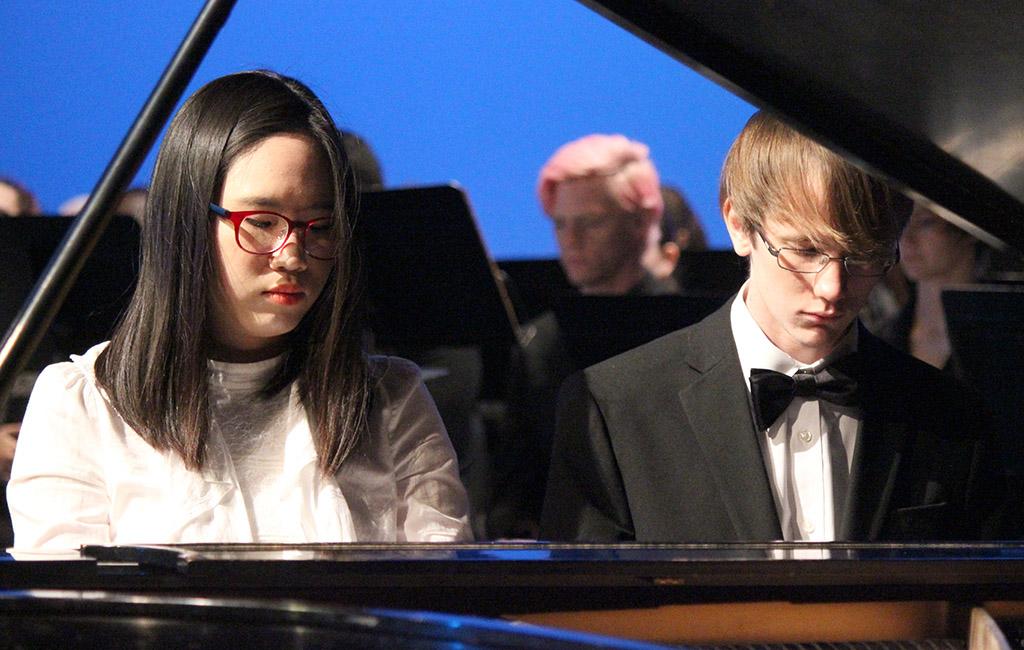 Nahey Byun, piano performance, and Aaron Johnson, piano performance sophomore, performed an original piece called "Homage" at the Inaguration of Suzanne Shipley, the eleventh president, held in Fain Fine Arts Auditorium, Dec. 11. Photo by Rachel Johnson