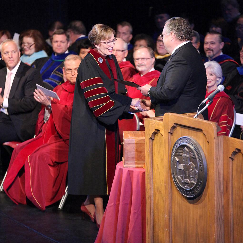 Craig Estes, Texas state senator, hands Suzanne Shipley, university president, a gift at the Presidential Inauguration in Fain Fine Arts Center Theatre, Dec, 11, 2015. Photo by Francisco Martinez