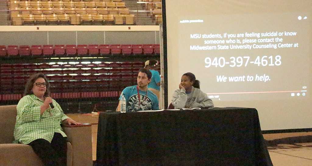 Pam Midgett, director of the couseling center, speaking about what the couseling center offers to students with Tim Torres, chemistry junior, and Tionne Fuller, social work junior, at News You Can Use preseted by the peer councellors on Aug 22nd in the D.L Ligon Coliseum. Photo by Kayla White.