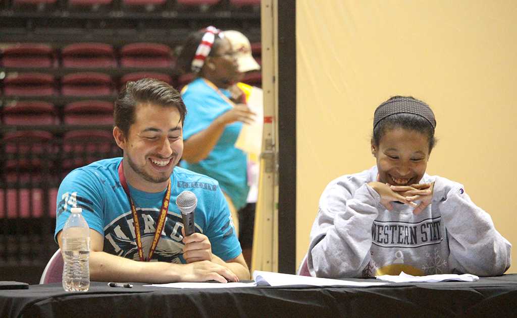Tim Torres, chemistry junior, and Tionne Fuller, social work junior, as news anchors at News You Can Use preseted by the peer councellors on Aug 22nd in the D.L Ligon Coliseum. Photo by Kayla White.