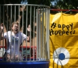 Morgan White, psychology sophomore, sits on the dunking booth during Roundup Olympics on the Quad Aug. 24. "The water wasn't cold," she said. "It feels uncomfortable being in the water in front of everybody." Photo by Bradley Wilson