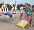 Addison Cassady, marketing freshman, tossing a beanbag at the Chi Omega beanbag toss during the Party at the soccer field on Aug 23rd in the parking lot of the soccer field. Photo by Kayla White.