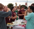 BSM members enjoy their free burgers and hot dogs together at the Party at the soccer field on Aug 23rd in the parking lot of the soccer field. Photo by Kayla White.