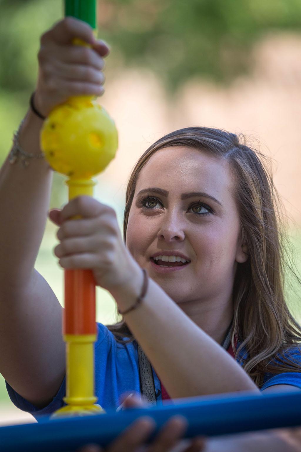 Katy Meadows, accounting freshman, builds a structure as part of Roundup Olympics on the Quad. Photo by Izziel Latour