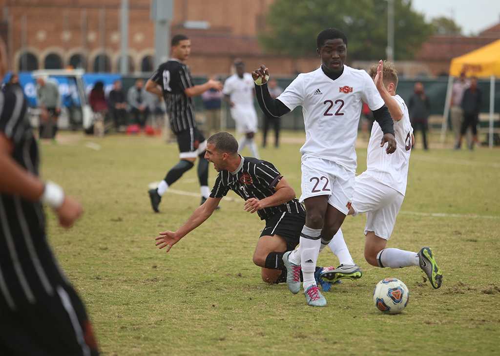 Saad Acheampong and another MSU player fight for the ball at the NCAA Division II South Central Regional, Nov. 12, 2017. MSU beat Colorado Mesa 3-0. Photo by Bradley Wilson