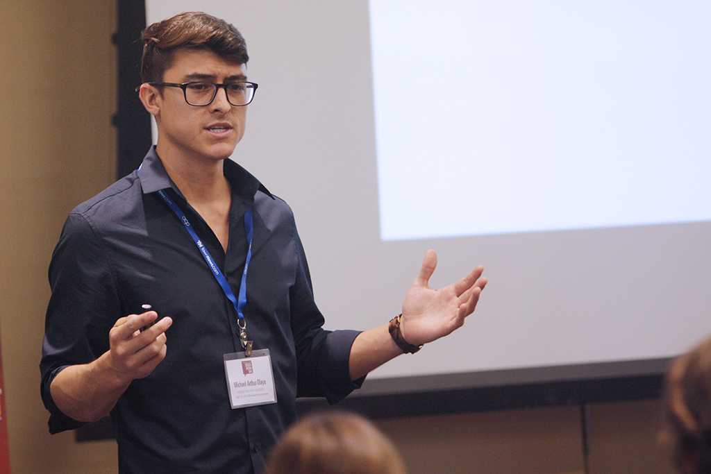 Michael Olaya, mechanical engineering senior, talks to vistors about using drones and how they help create new opportunities for individuals and small groups to puch the limits of creativity at social media day in the Legacy Multipurpose room on Sept. 25. Photo by Justin Marquart