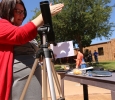 Dean Margaret Brown Marsden shows the eclipse as transmitted through a telescope at the solar eclipse watch party Aug. 21, 2017 on Sunwatcher Plaza at Midwestern State University. Photo by Bradley Wilson