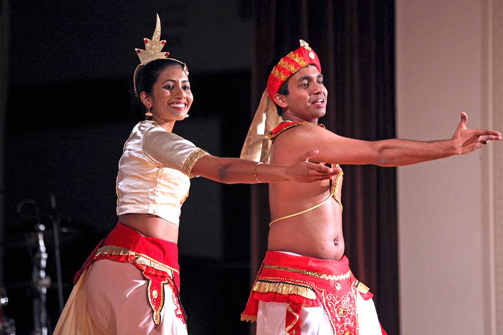 Tharusha Wanigasekera, Mechanical Engineering Senior and Sandali Chandrasa, Biology Junior at the University of Maryland gesture to crowd after traditional dance.Mustangs On Stage Talent Show hosted by Sri Lankan Students Organization at Akin Auditorium.March 25th.by Timothy Jones