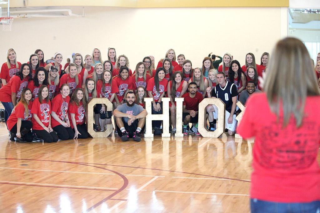 The winning team, Thunder, takes a picture with all of the members of Chi Omega at the end of the Swishes 4 Wishes basketball tournament held in the Wellness Center, March 12. Photo by Rachel Johnson