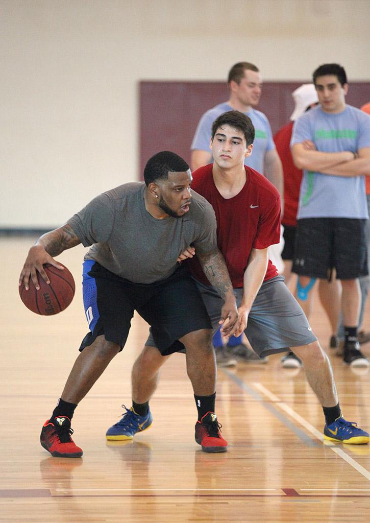 Mike Lopez, sports and leisure sophomore, attempts to block Jay Gould, Vernon student, during the basketball tounament, Swishes 4 Wishes, put on by Chi Omega, March 12. Photo by Rachel Johnson