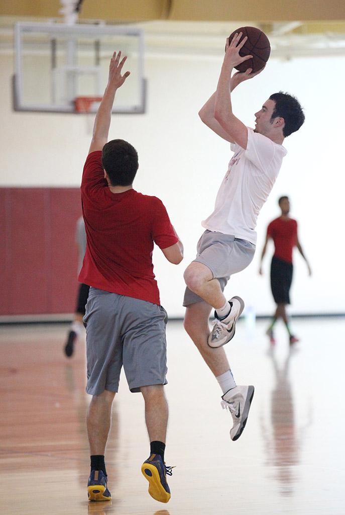 Zach Davis, junior, goes up for the shot against the E-Lemon-Ators and makes it during the basketball tounament, Swishes 4 Wishes, put on by Chi Omega, March 12. Photo by Rachel Johnson